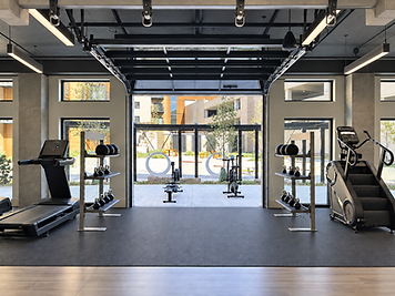 Completed installation — Cardio & storage facing the open garage door