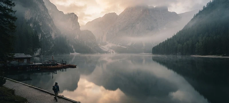 A misty European mountain lake at dawn