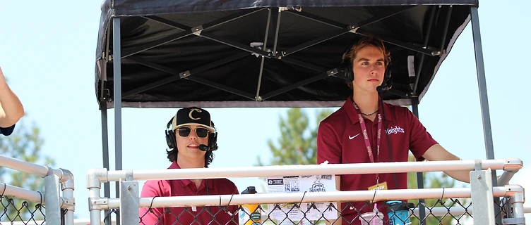 Andrew Henderson calling play-by-play from the broadcast booth