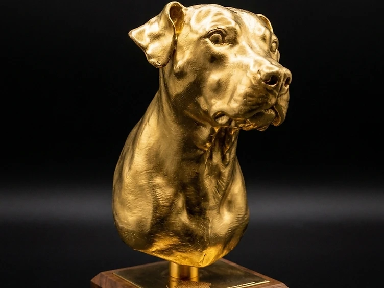 Gold finish dog bust on walnut base