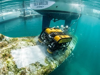 Robotic hull cleaning afloat — removing biofilm and algae.