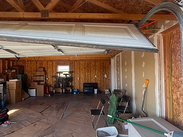 Off-track garage door with a broken cable repaired by M Garage Door Repair