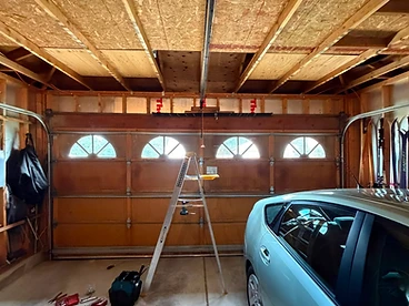 Same-day garage door repair in progress at a Fort Collins home