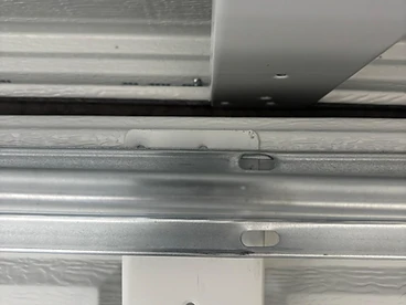 Garage door track realignment and mounting hardware service