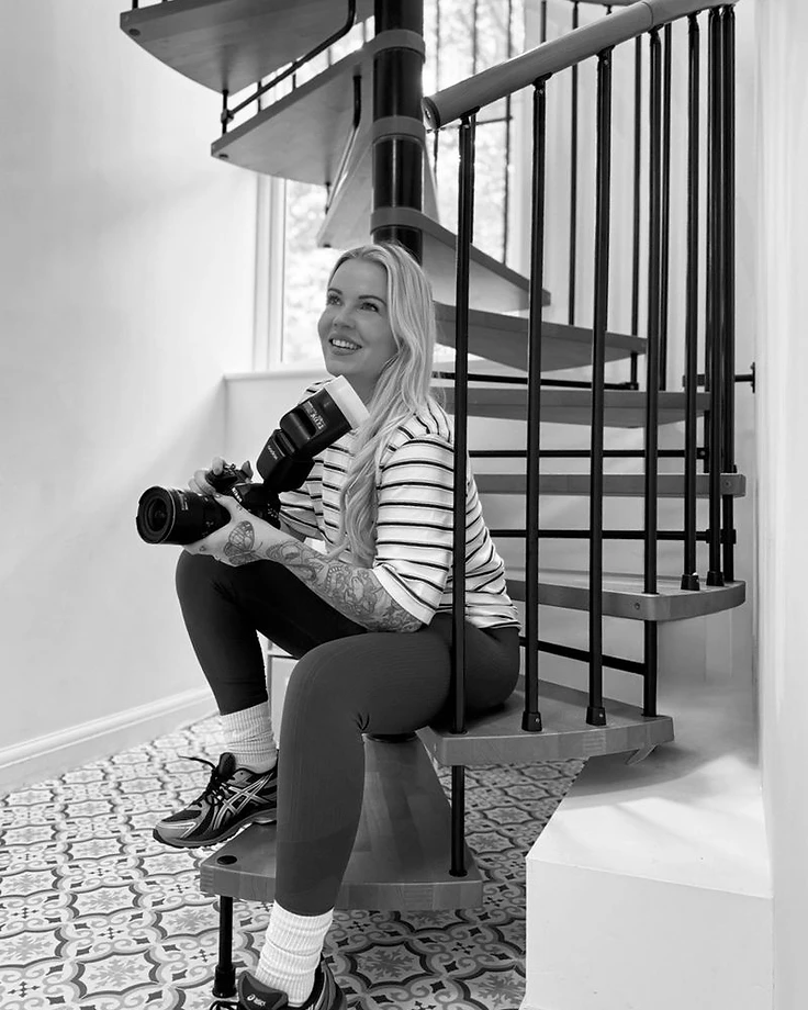 Jenna — the photographer behind JL Property Marketing, with her camera