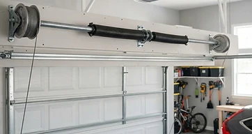 Torsion Springs vs. Extension Springs: Differences, Lifespan & Costs