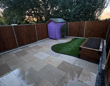 Porcelain patio with sleeper bed and turf island