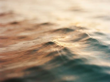 Soft sunrise light diffusing through water