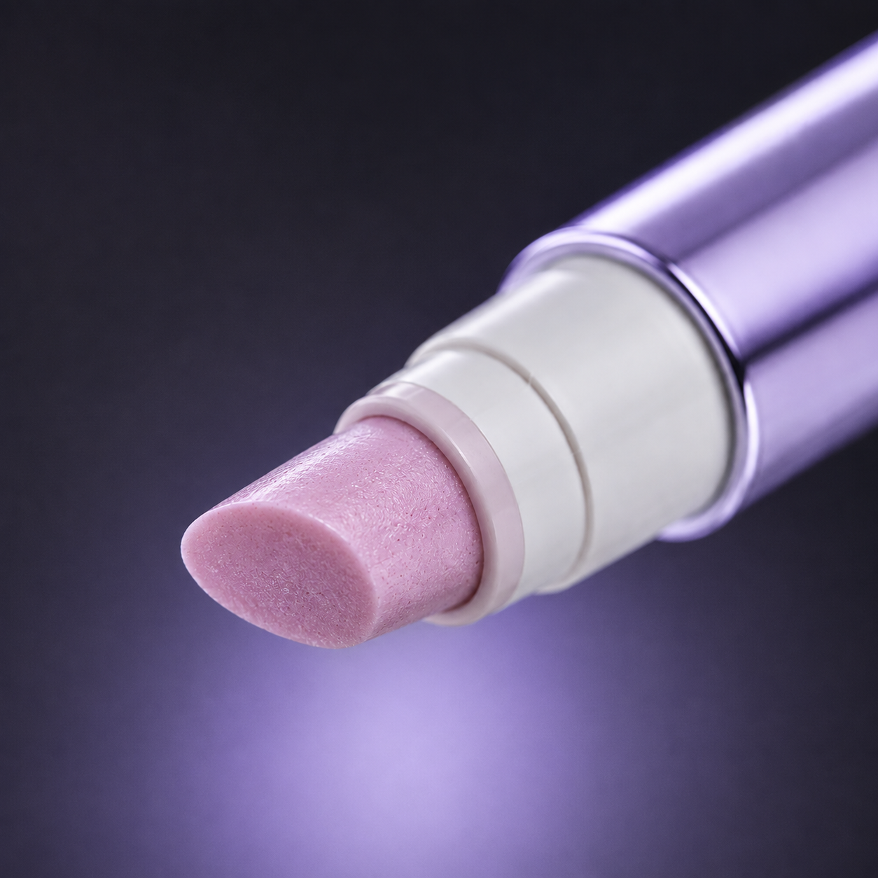 Extreme close-up of the pen tip, pale pink matte ceramic, the angle visible.
