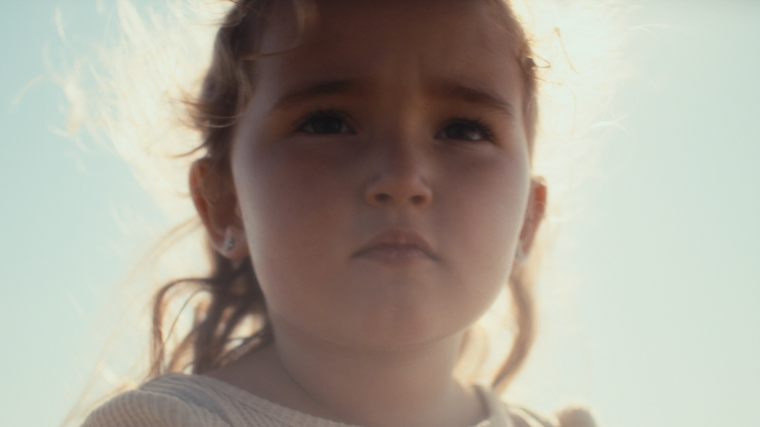 A backlit portrait in soft wind and haze