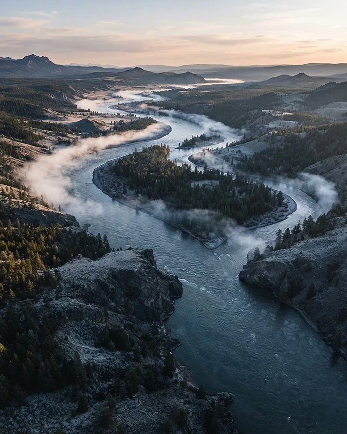 Aerial view of a river confluence at dawn