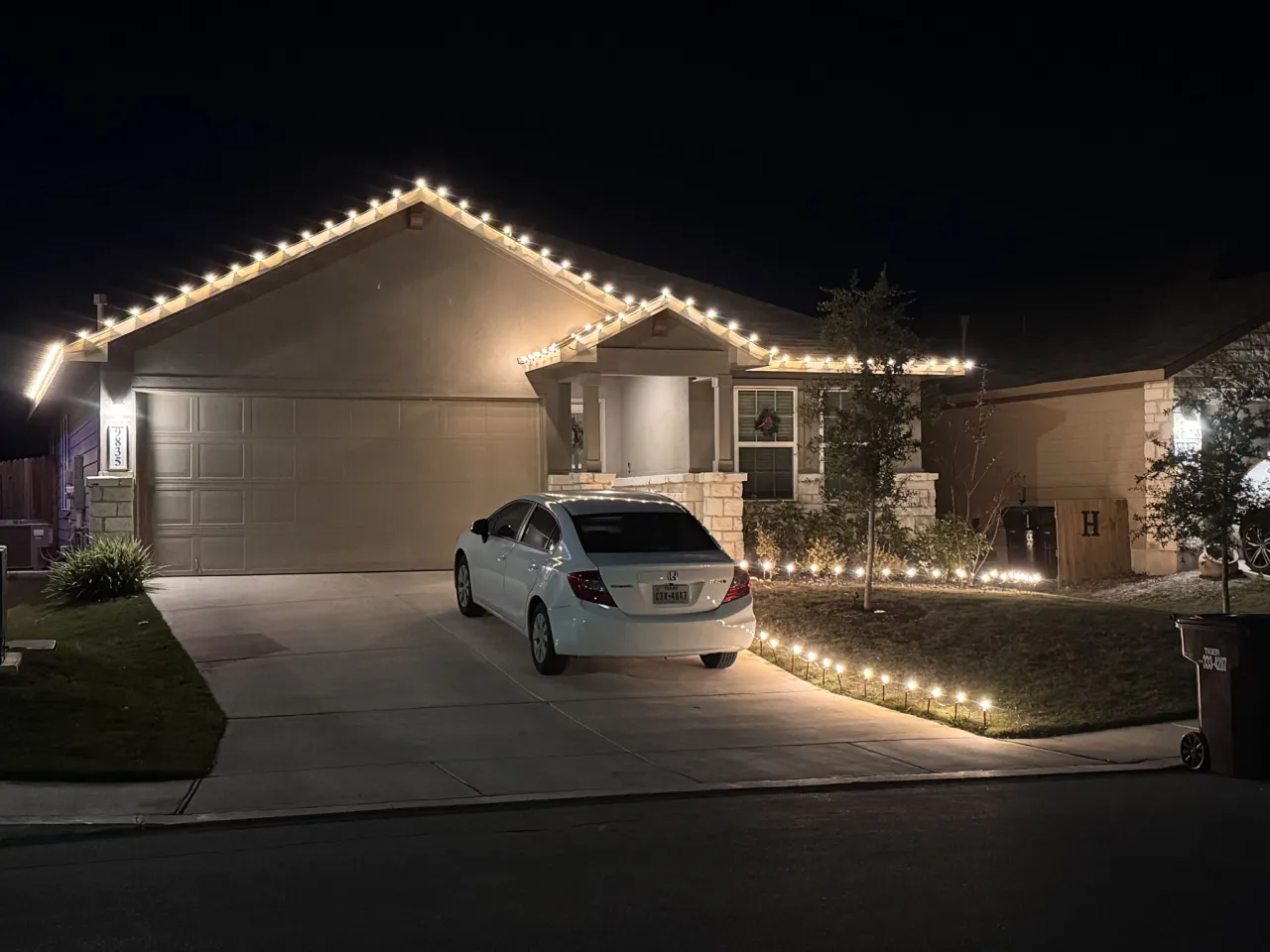 Warm White Single Story Roofline and Driveway, classic warm white holiday lighting installation by Brilliance Lighting