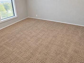 Bedroom before carpet removal and flooring replacement