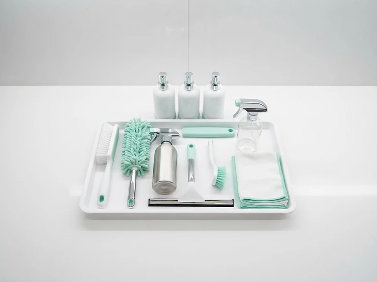 Color-coded microfiber and restocked consumables in a commercial restroom