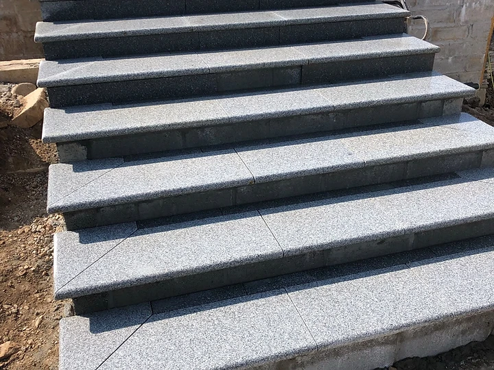 Granite garden staircase with bullnose treads under construction