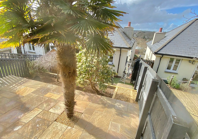 Completed natural stone patio landscaping project in Cornwall