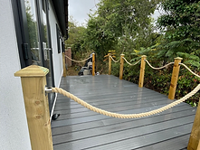 Composite decking with timber posts and rope balustrade in Cornwall