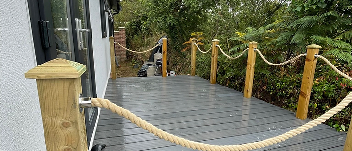 Composite decking with timber posts and rope balustrade in Cornwall