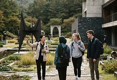 Students with a guide at the Museum San sculpture garden