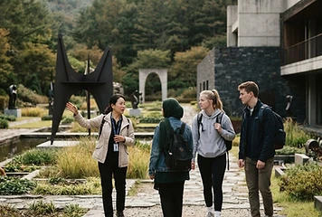 Students with a guide at the Museum San sculpture garden