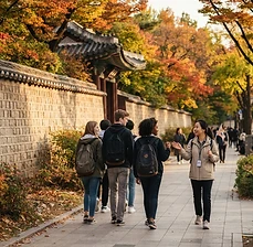 Students with a guide along the Deoksugung stone-wall road