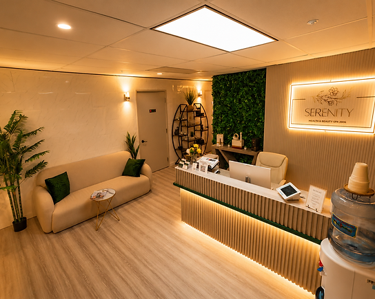 Front desk and waiting lounge beneath the illuminated Serenity sign