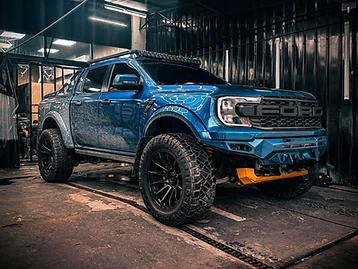 Customized blue Ford Ranger Raptor protected with TOKYOFILMS Paint Protection Film inside the detailing studio.