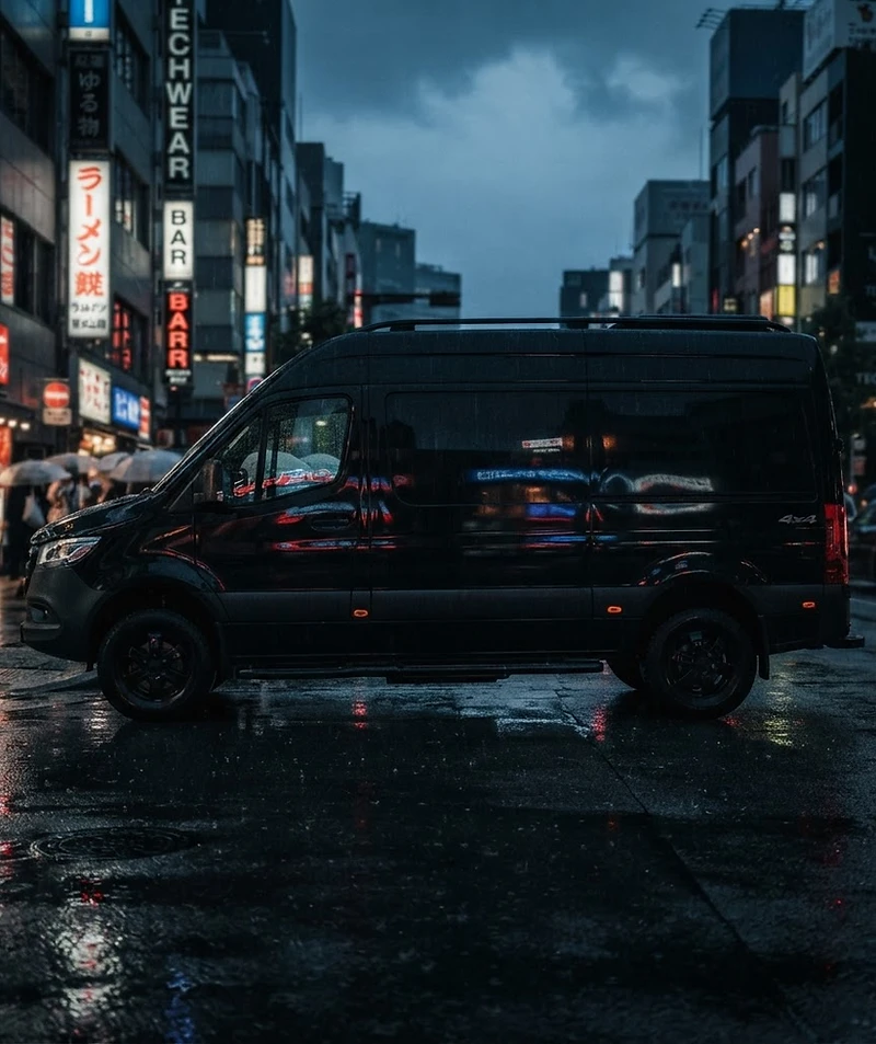 Sprinter van on a city street at dusk