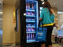 Toyota experiential kiosk at a live event with an attendee interacting with the machine