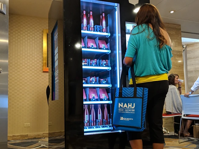 Toyota experiential kiosk at a live event with an attendee interacting with the machine
