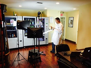 Build and test lab with two vending machines, a camera rig and a technician in a lab coat