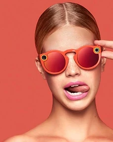 Editorial portrait of a person wearing Snapchat Spectacles camera glasses