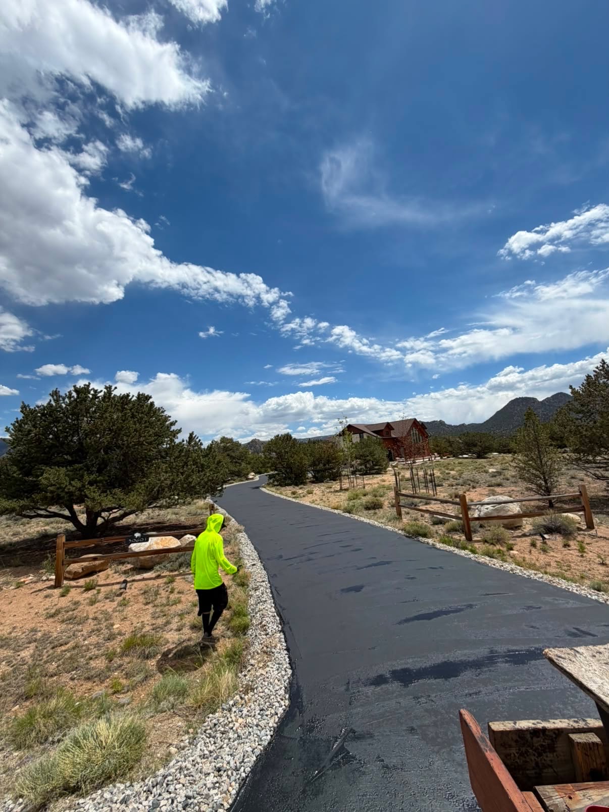 Long winding residential driveway freshly seal-coated
