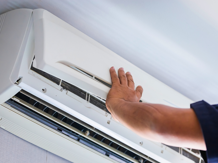 Air conditioning service visit for a wall-mounted unit