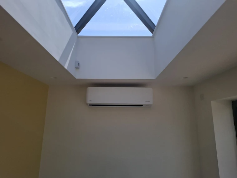 Wall-mounted air conditioning unit installed in a home