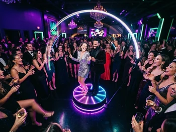 Neon gala send-off — the whole dance floor spinning in slow motion.
