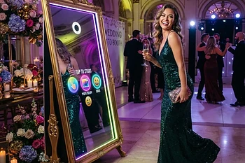 Step-and-repeat activation — branded overlay and instant digital delivery.