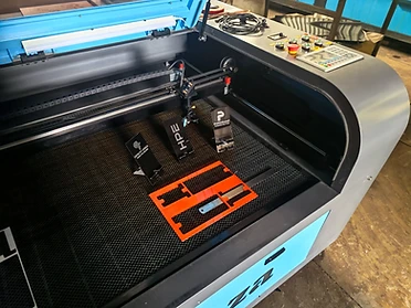 Laser-cut and engraved samples and components produced on the KEVMAR laser system.