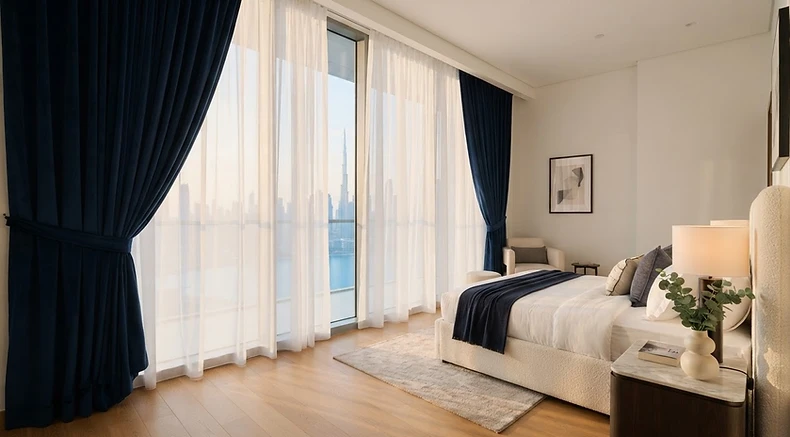Freshly cleaned sheer and blackout curtains in a Dubai bedroom