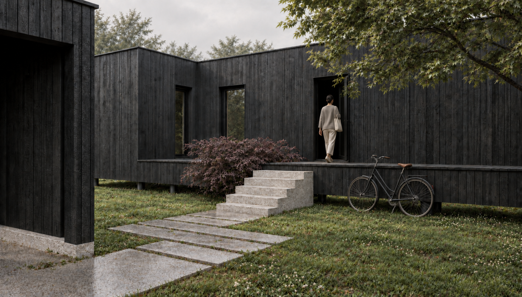 Maison en bois brûlé, entrée et vélo sur la terrasse
