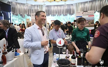 Professional wine and spirits buyers at registration desk entering the Interwine exhibition hall
