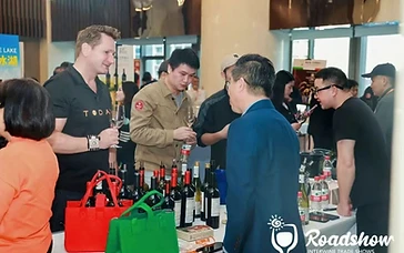 Wine export manager reviewing distribution agreements and wine samples for the Hanoi Vietnam roadshow