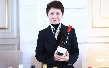 Wine export manager reviewing distribution agreements and wine portfolios with an importer in China