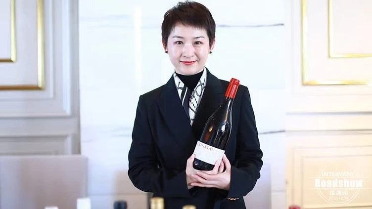 Wine export manager reviewing distribution agreements and wine portfolios with an importer in China