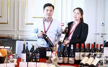 B2B wine buyers and producers reviewing portfolios and schedules on a digital business-matching system