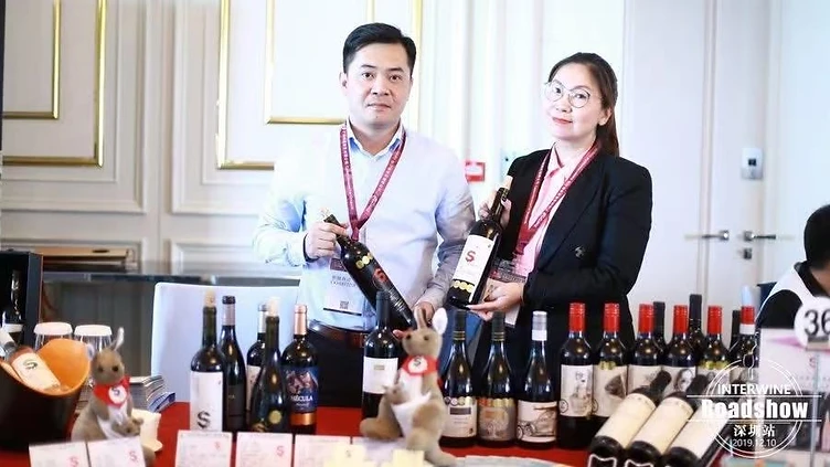 B2B wine buyers and producers reviewing portfolios and schedules on a digital business-matching system