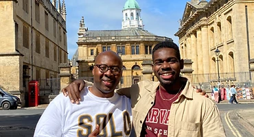 Brothers posing on a historic Oxford street