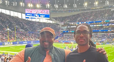 Brothers at a football stadium game