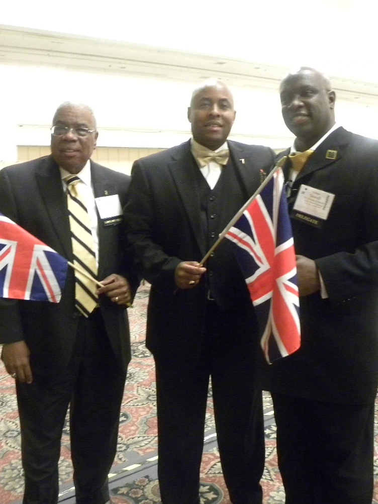 Brothers holding Union Jack flags at a General Convention