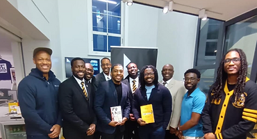 Brothers gathered indoors at a fraternity event